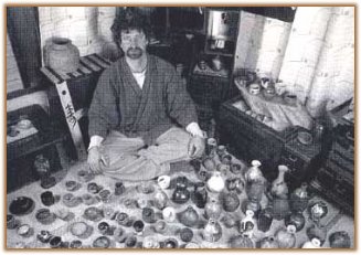 Robert Yellin sitting in his pottery room