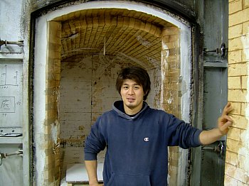 Nishida Jun in front of his kiln