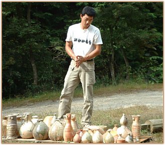 Tsujimura Kai Looking Over His Pots